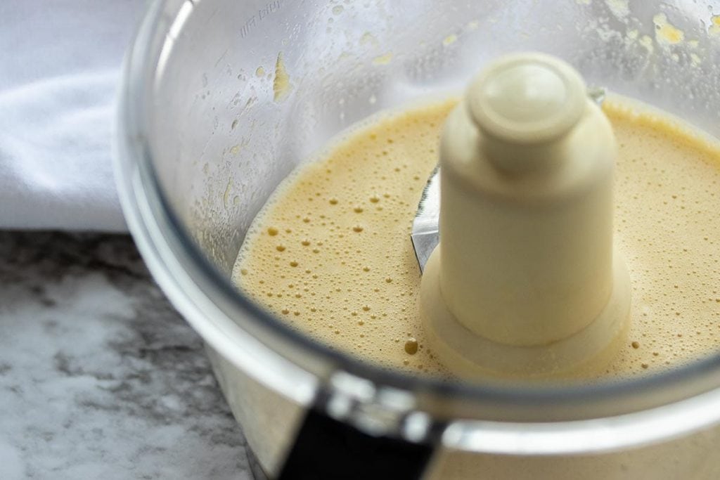 Egg, vanilla and apple sauce mixed together in a food processor