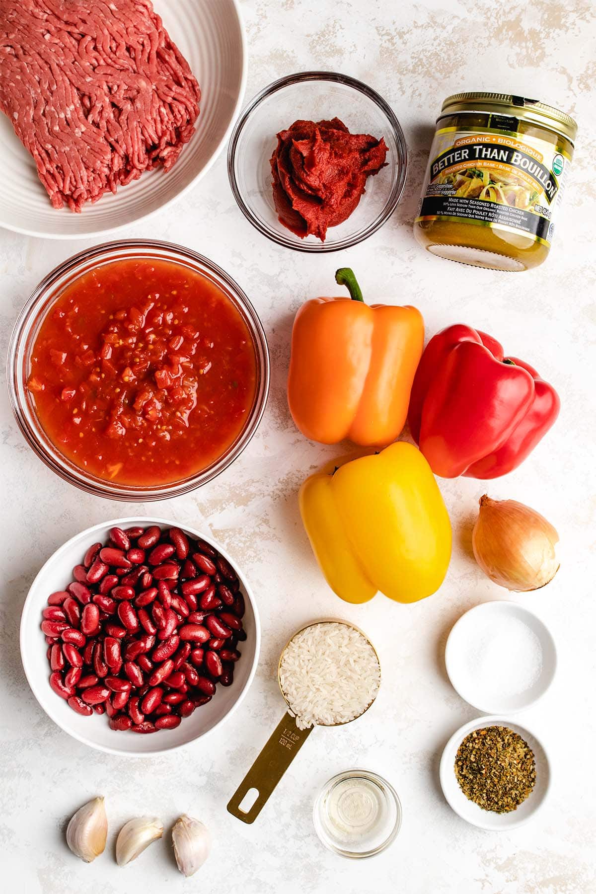 Ingredients for Instant Pot Stuffed Pepper Soup in glass bowls, viewed from overhead
