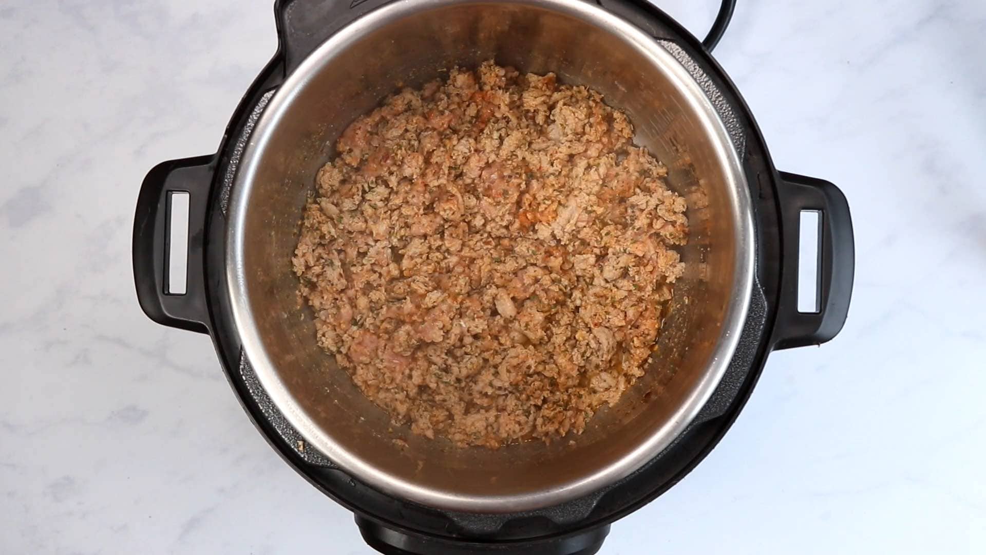 browned ground turkey and spices in an Instant Pot