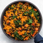 Sweet Potato, Kale and Black Bean Breakfast Skillet in a black skillet viewed from overhead