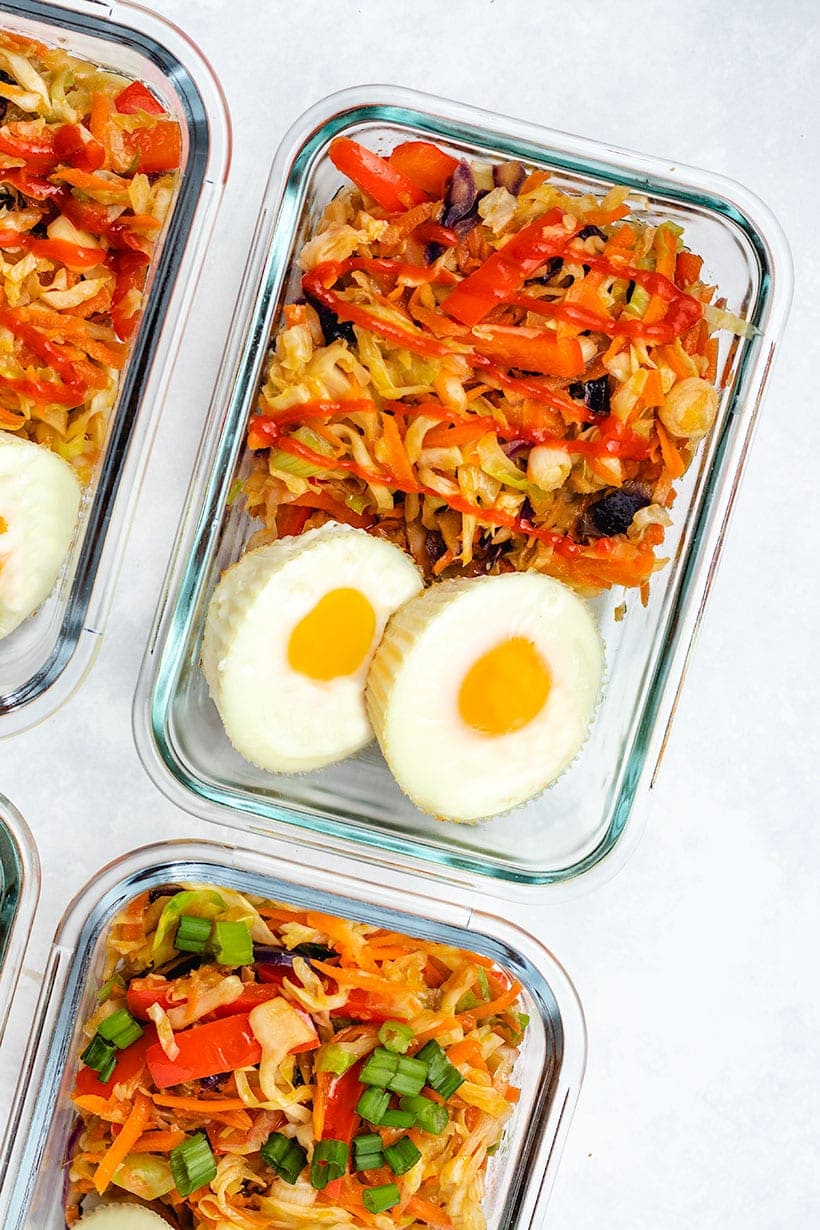 egg roll in a bowl served with two egg muffins in glass meal prep containers