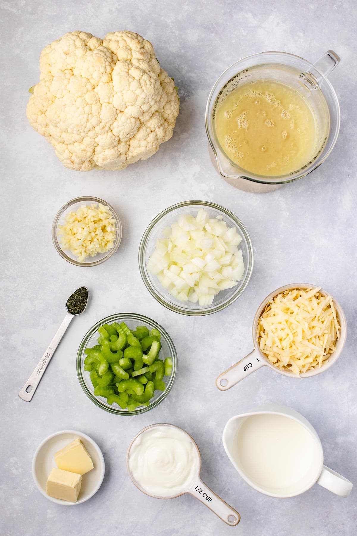Ingredients for loaded cauliflower soup viewed from overhead.