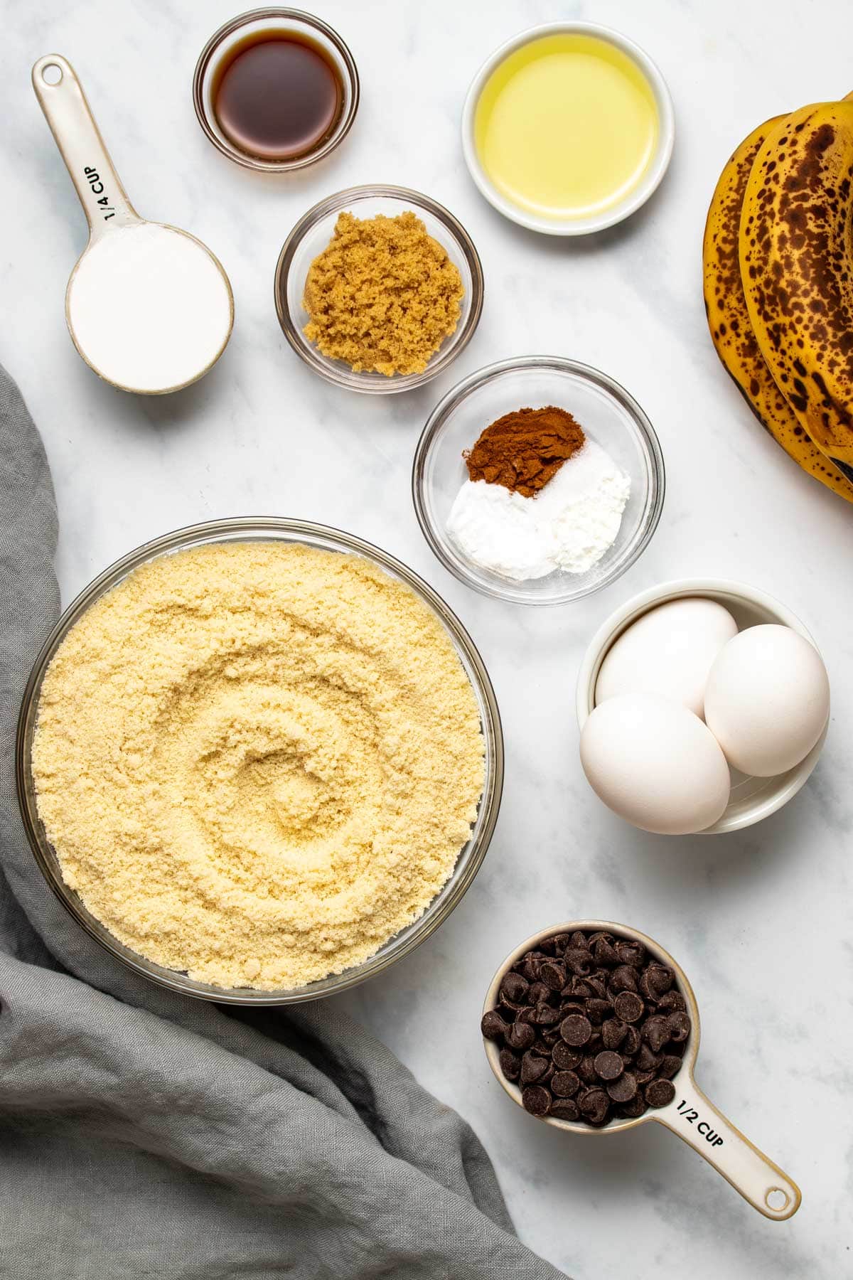 Ingredients needed to make almond flour banana bread, viewed from overhead.