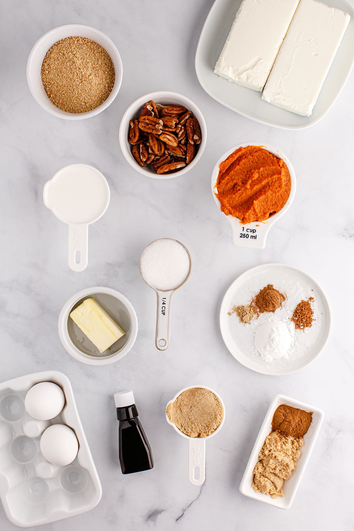 Ingredients needed to make Instant Pot Pumpkin Cheesecake, viewed from overhead.