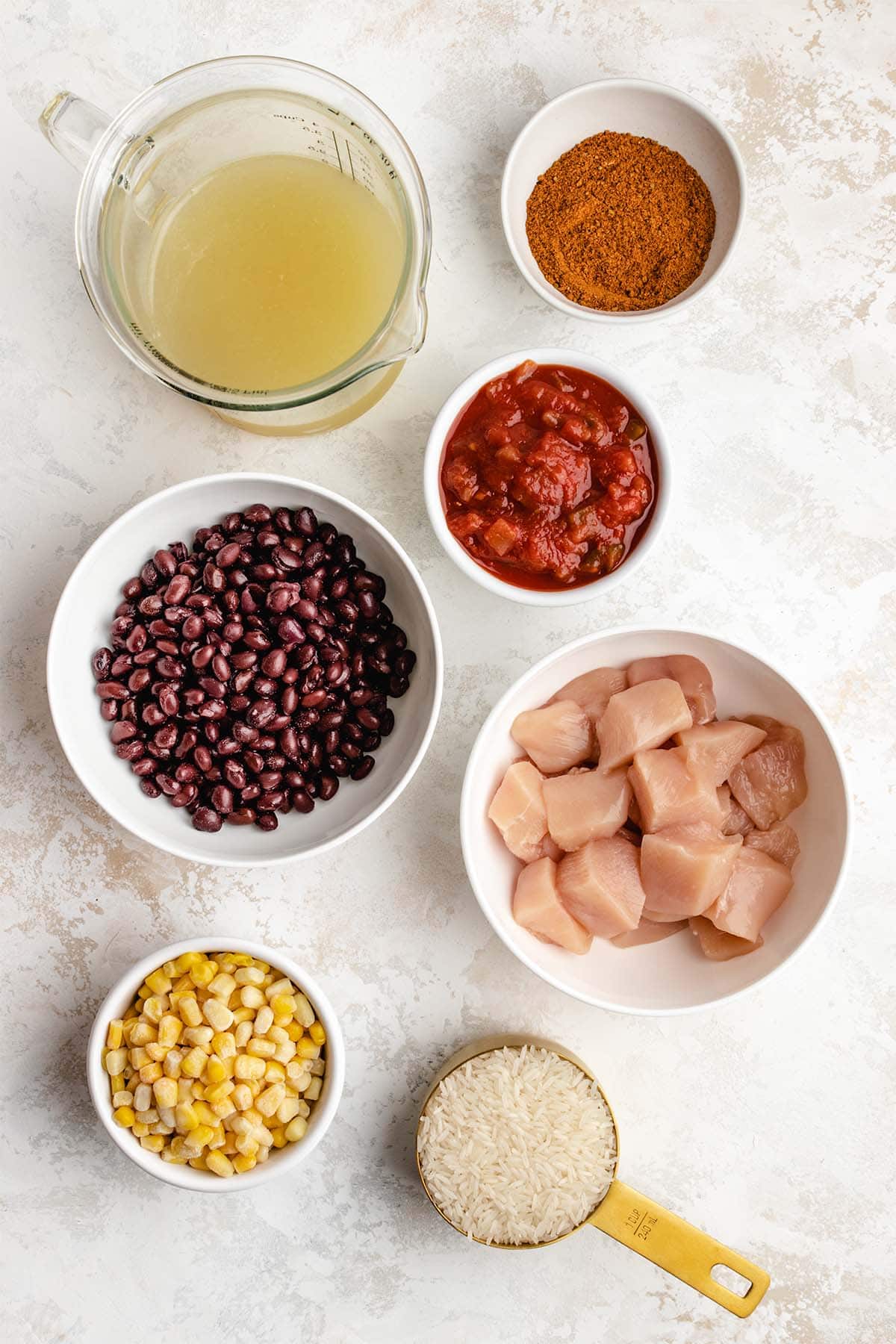Ingredients needed for Instant Pot Burrito Bowl viewed from overhead.