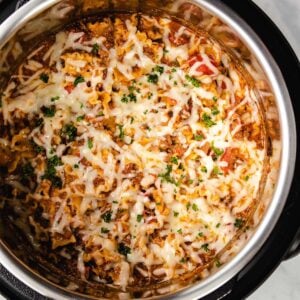 Lazy Lasagna in an Instant Pot garnished with parsley, viewed from overhead.