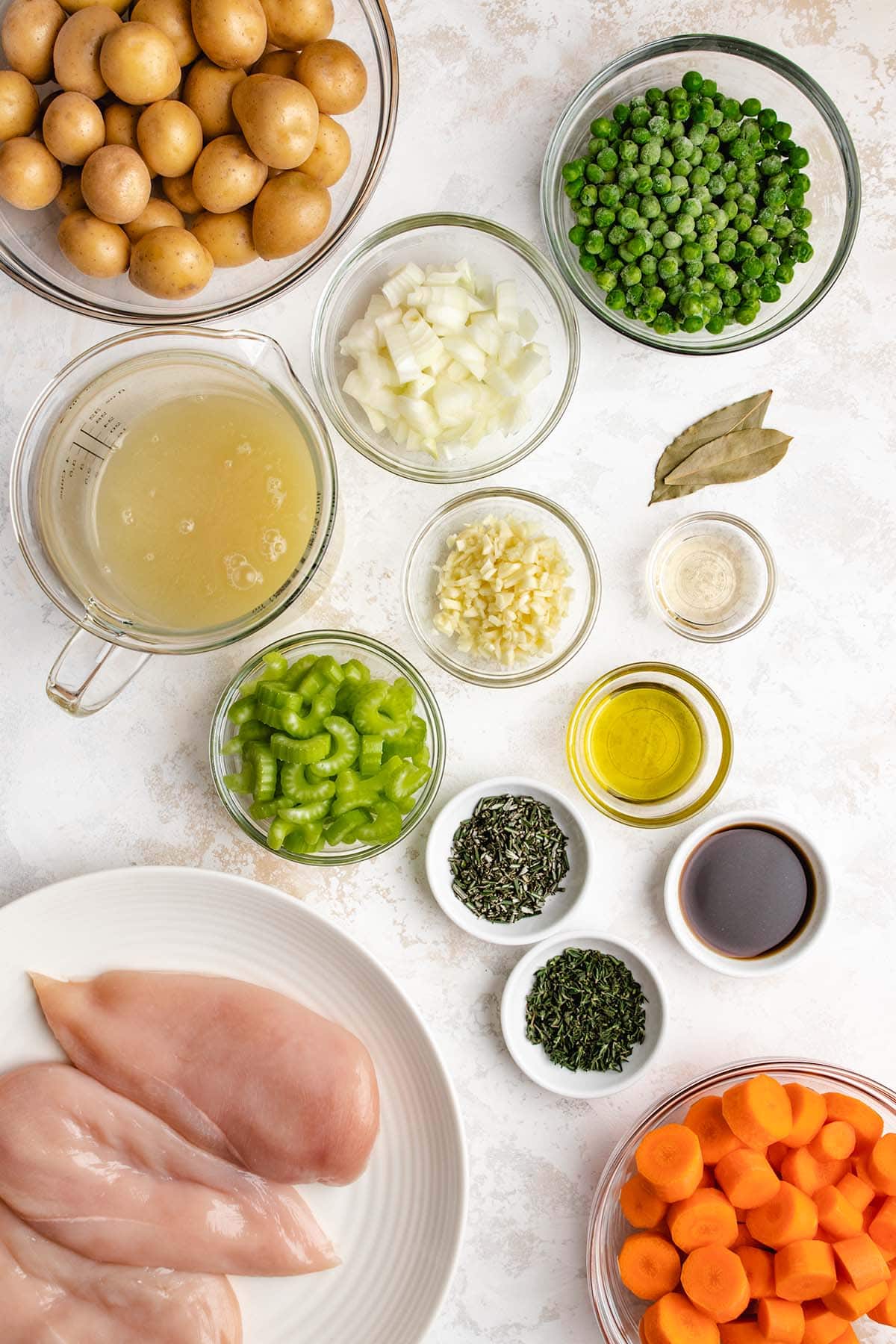 Ingredients needed to make Instant Pot Chicken Stew, viewed from overhead.