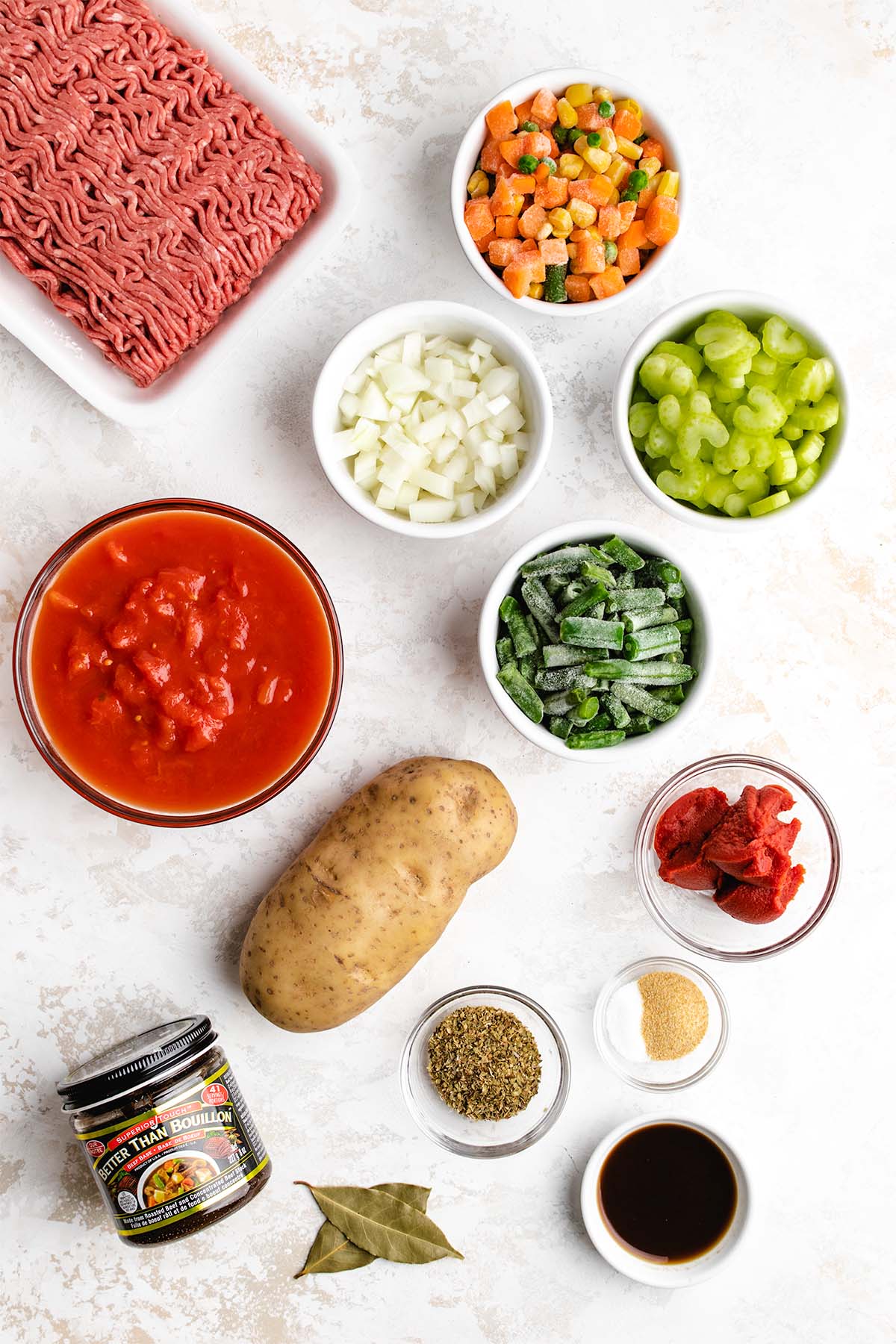 Ingredients needed to make Instant Pot Hamburger Soup viewed from overhead.