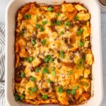 Sausage, Egg and Cheese Casserole in a white rectangular dish viewed from overhead.